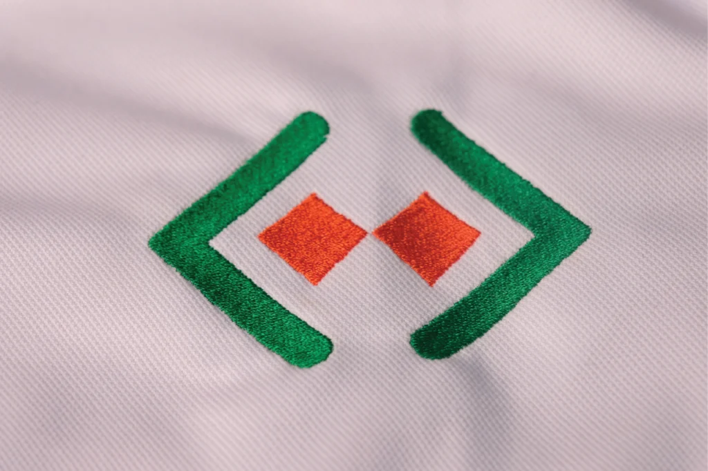 Embroidered golf shirt branding in Midrand — premium corporate logo stitching by Pixelsinframe