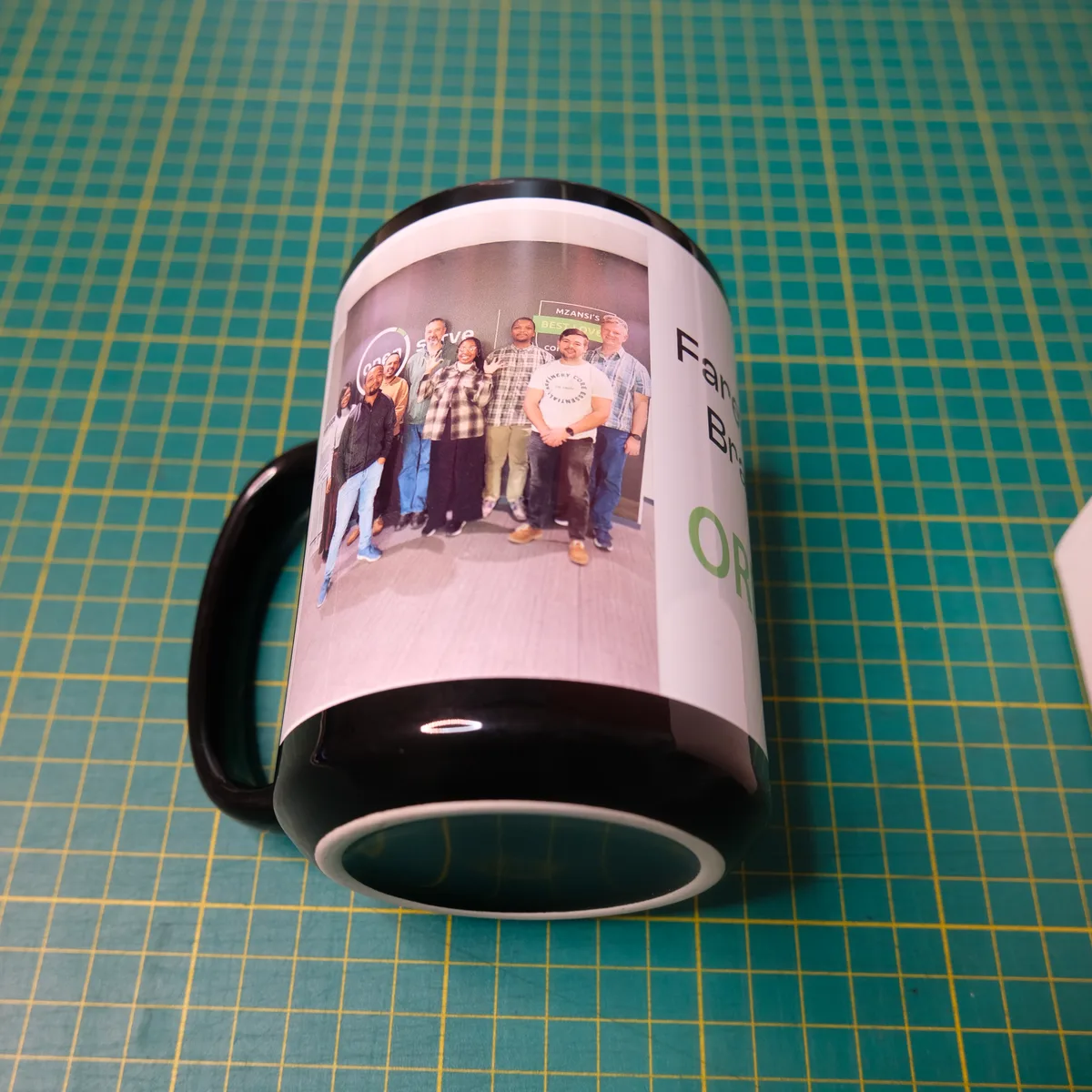 Black patch 15oz mug printed with a team photo in Midrand