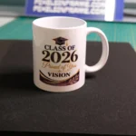 White 11oz mug printed with a Class of 2026 graduation design