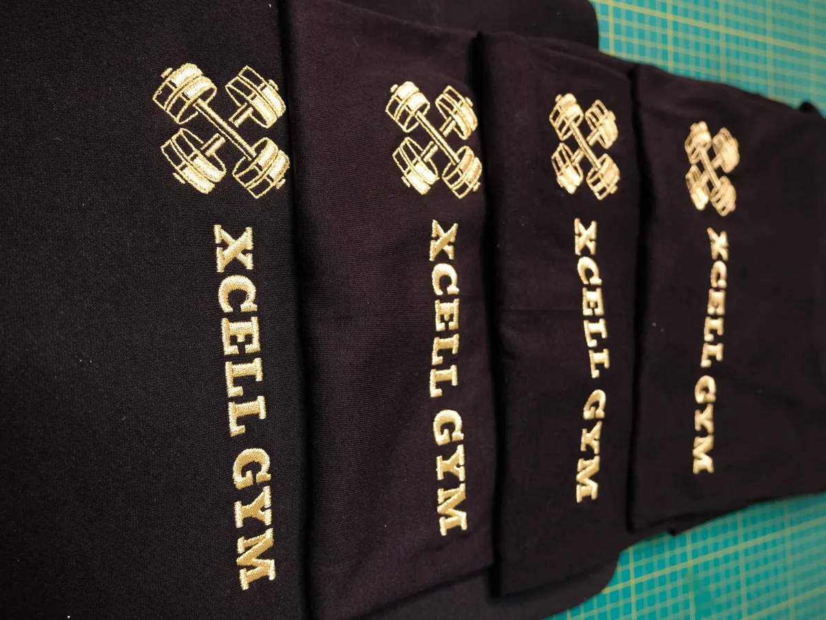 Gold print on black gym T-shirts